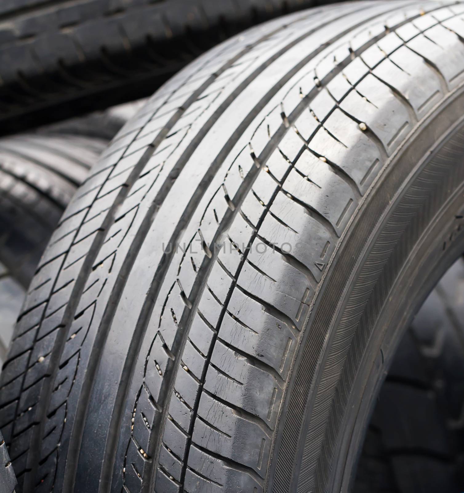 Close up old tires in the tire repair shop yard