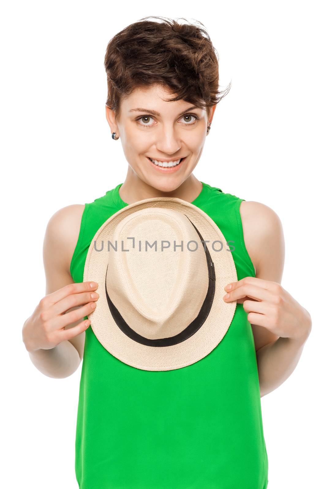 Vertical portrait of a young woman with a hat on a white background