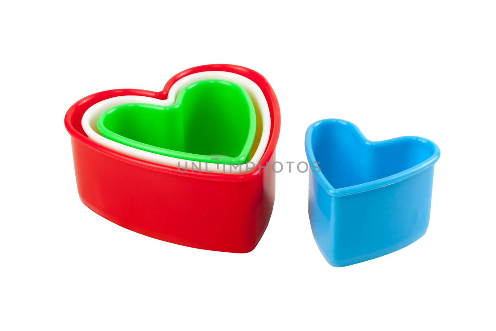 Idea for card Valentine day. Heart shaped cookie cutter on white background. Isolated on white with work paths.