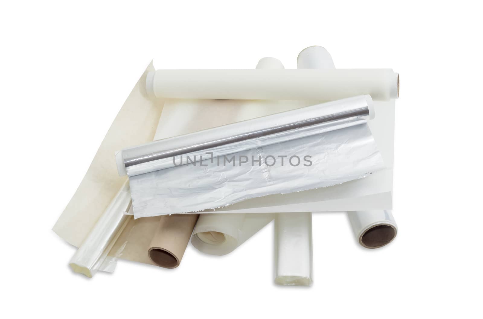 Several rolls of the plastic oven bags, plastic food wrap, aluminum foil and various parchment paper for household use on a light background. 
