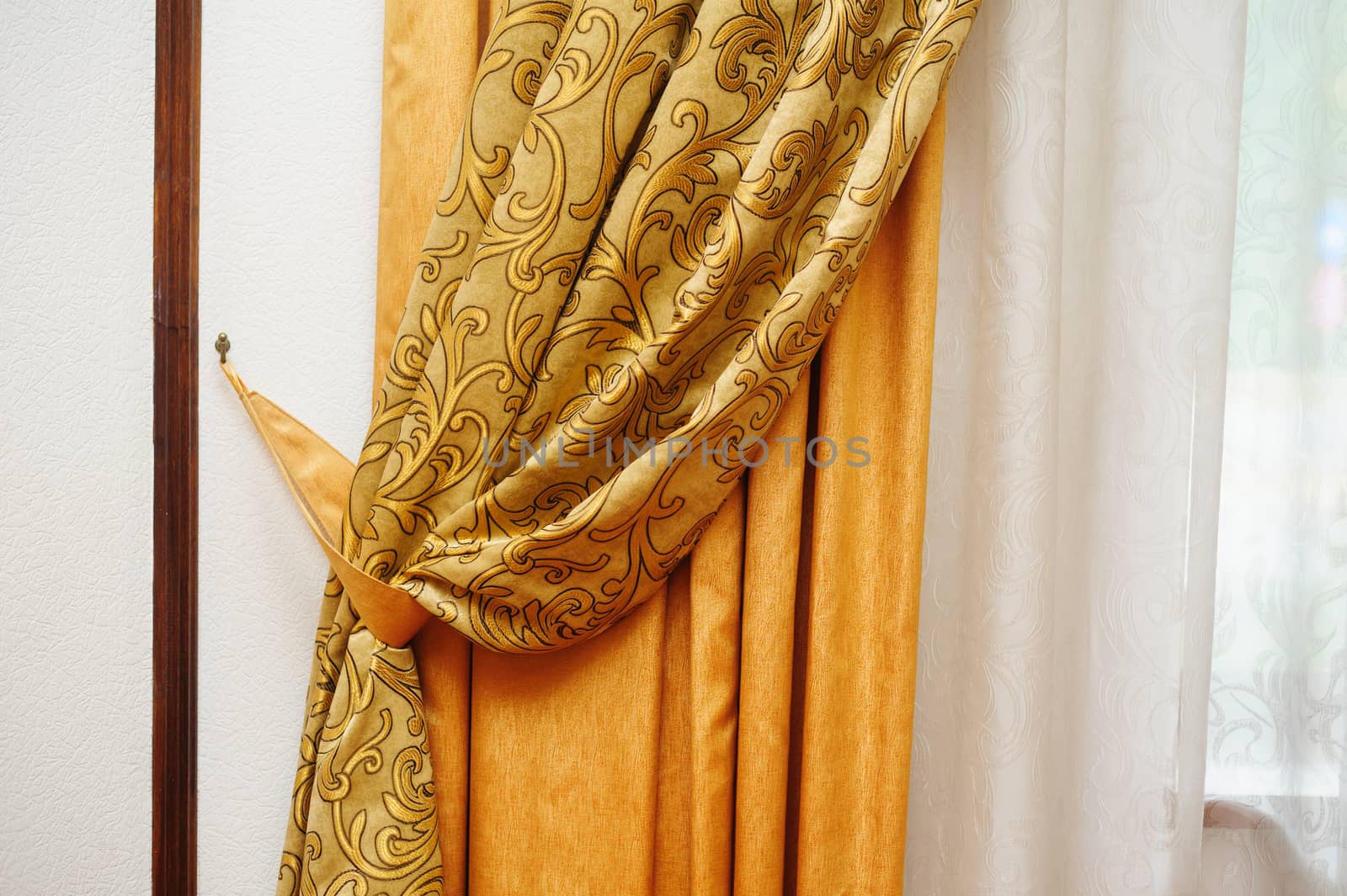 golden curtain on the window in the room by timonko