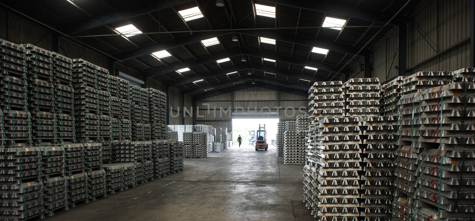 Stack of raw aluminum ingots in aluminum profiles factory, France