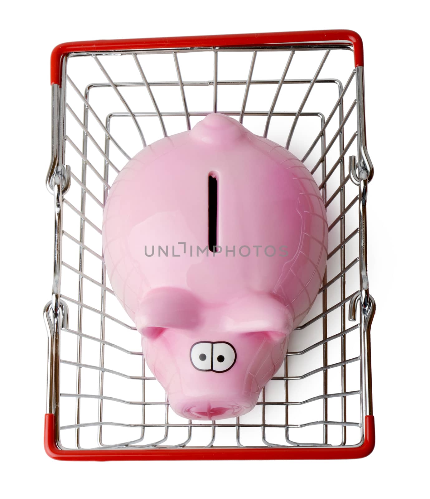 Piggy bank in a shopping basket viewed from above isolated on a white background