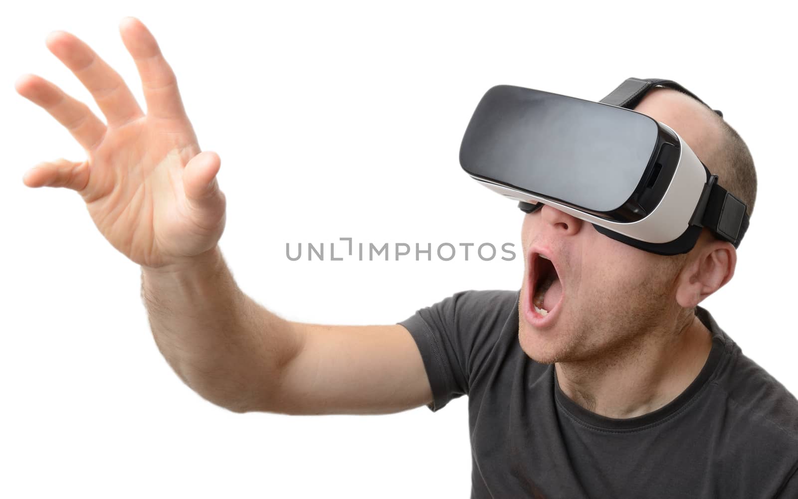 Excited man using a VR headset and experiencing virtual reality isolated on white background