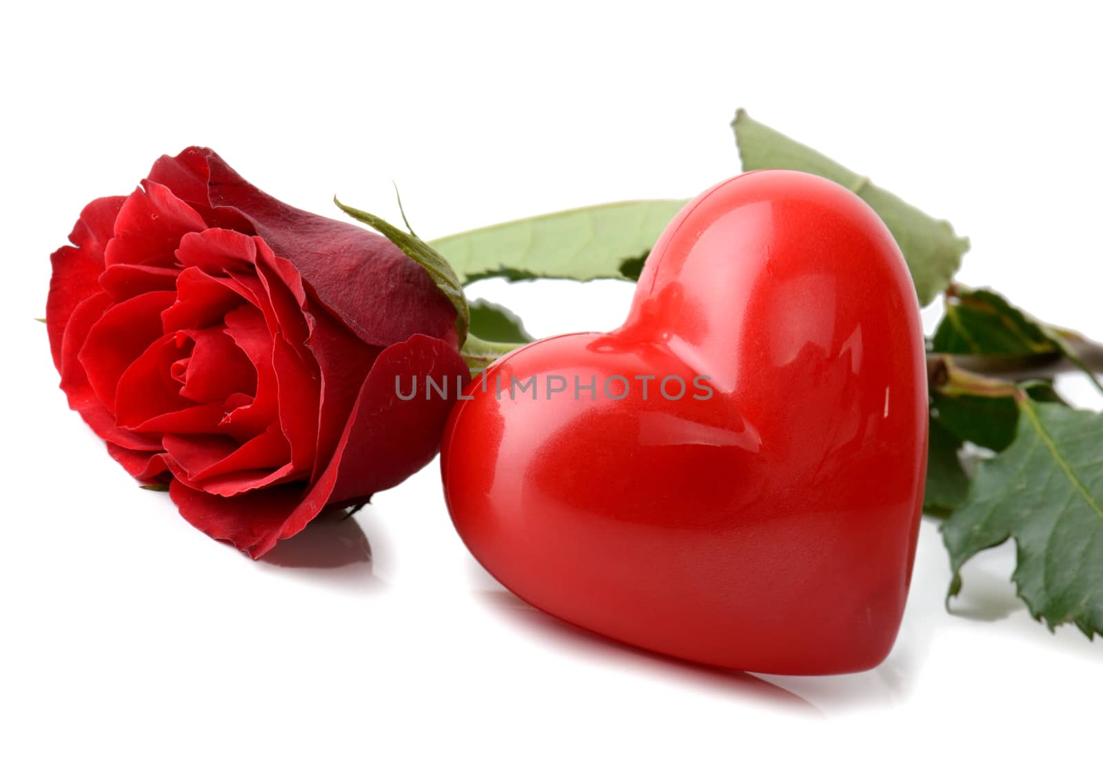 Single red rose and red heart isolated on a white background