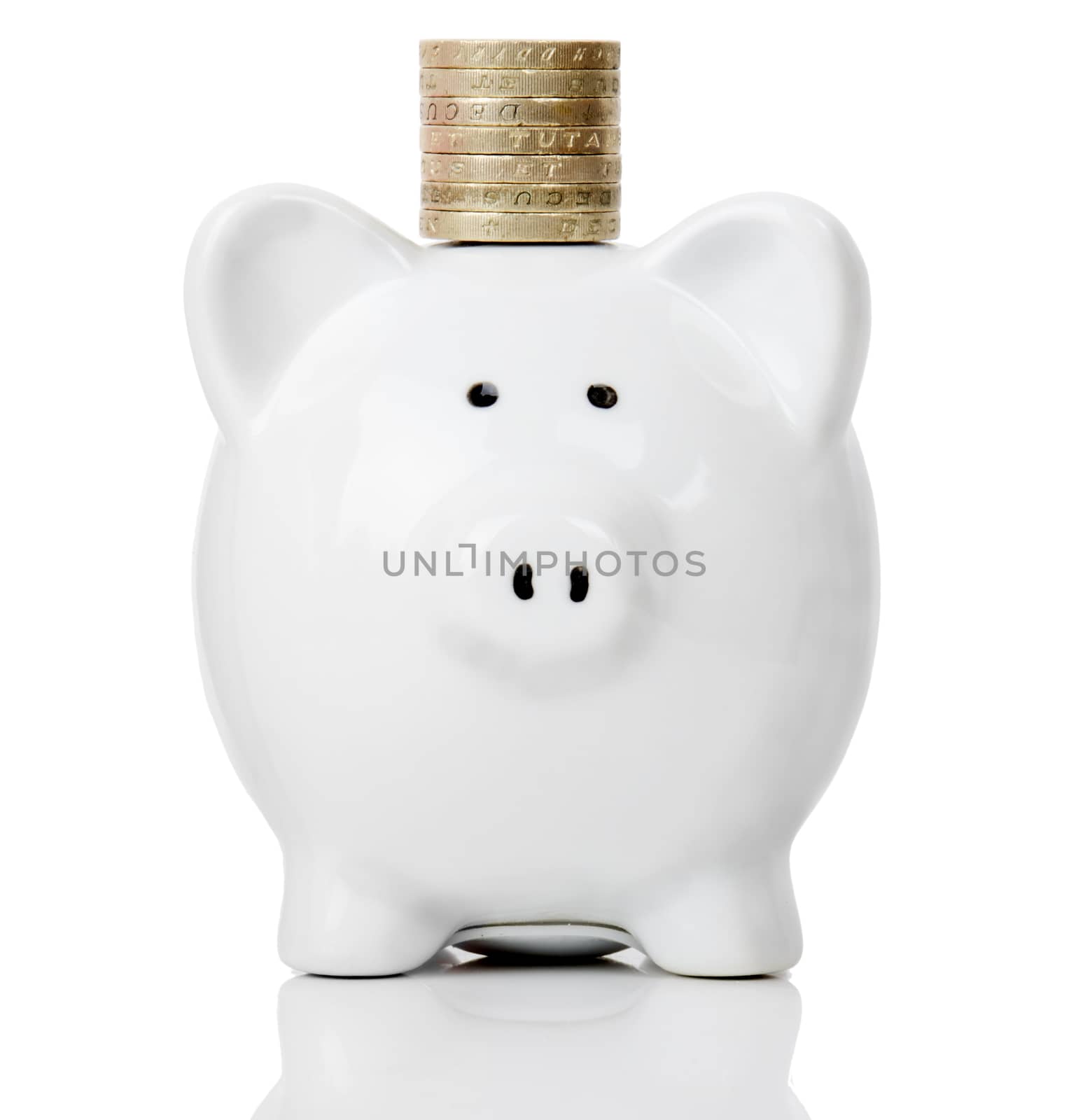 piggy bank with a stack of coins isolated on a white background