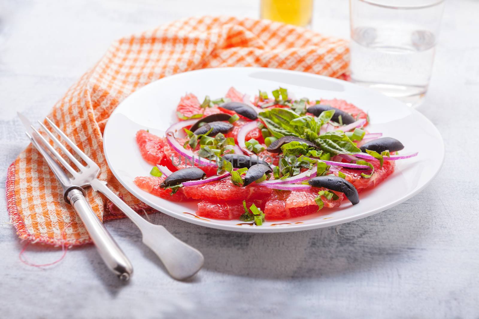 Grapefruit salad with olives, red onion basil
