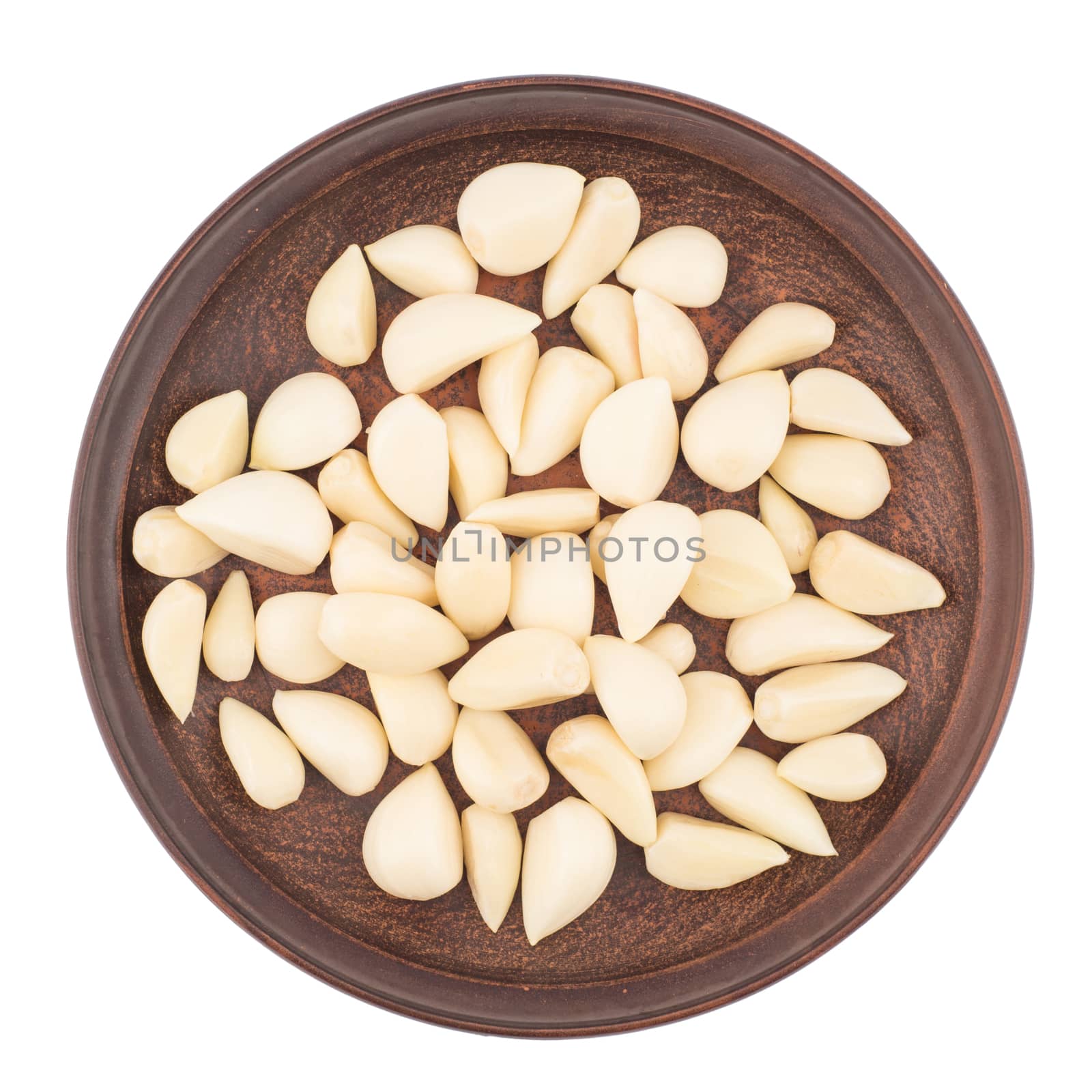 Garlic cloves in plate from top including clipping path. Top view.
