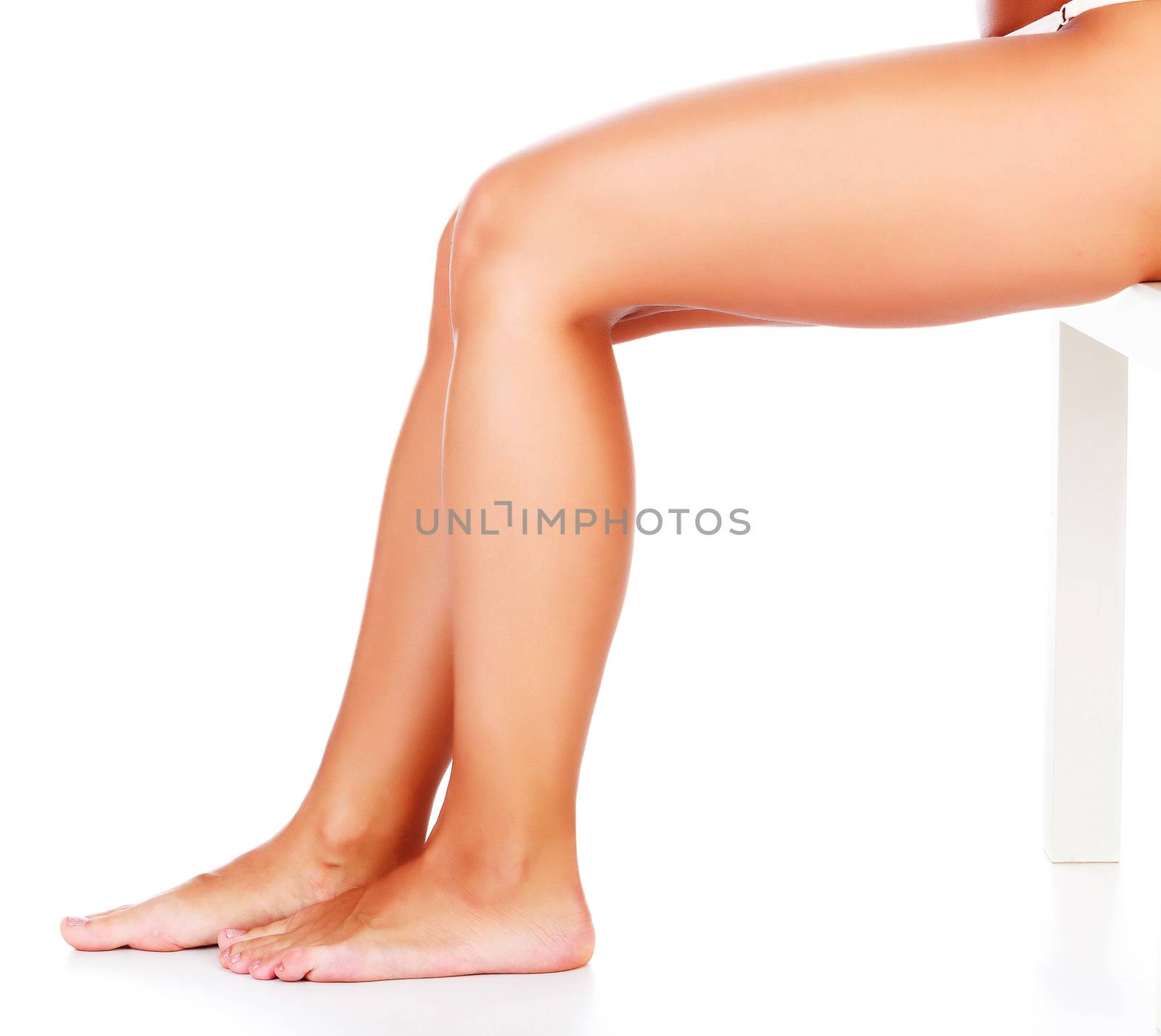 Beautiful woman legs on white background, isolated