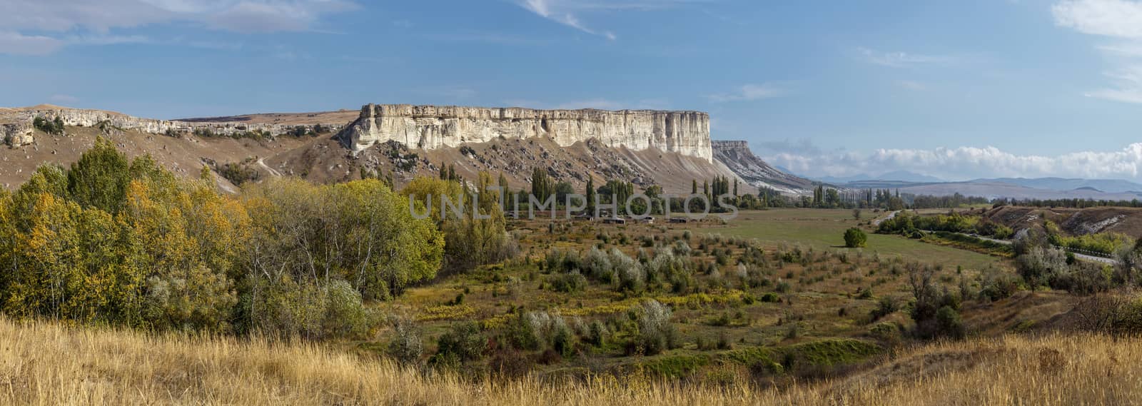 old autumn garden, against the white rocks and the blue sky