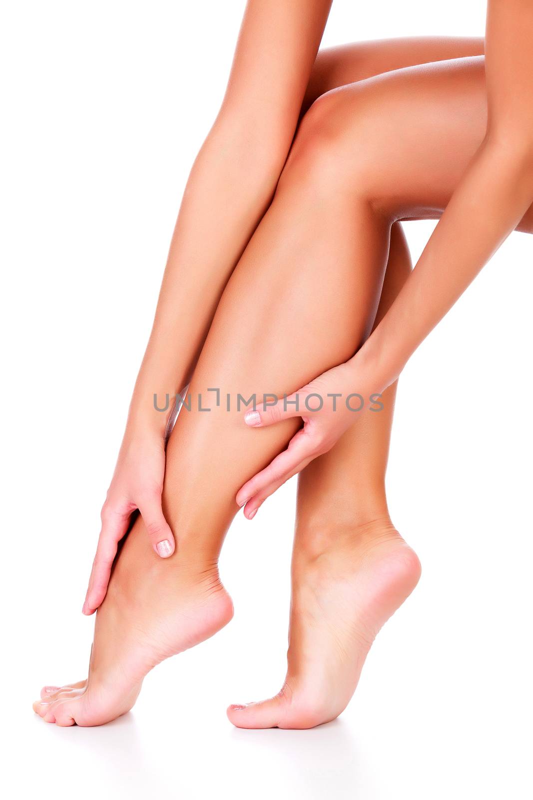 Female legs and hands, white background, isolated