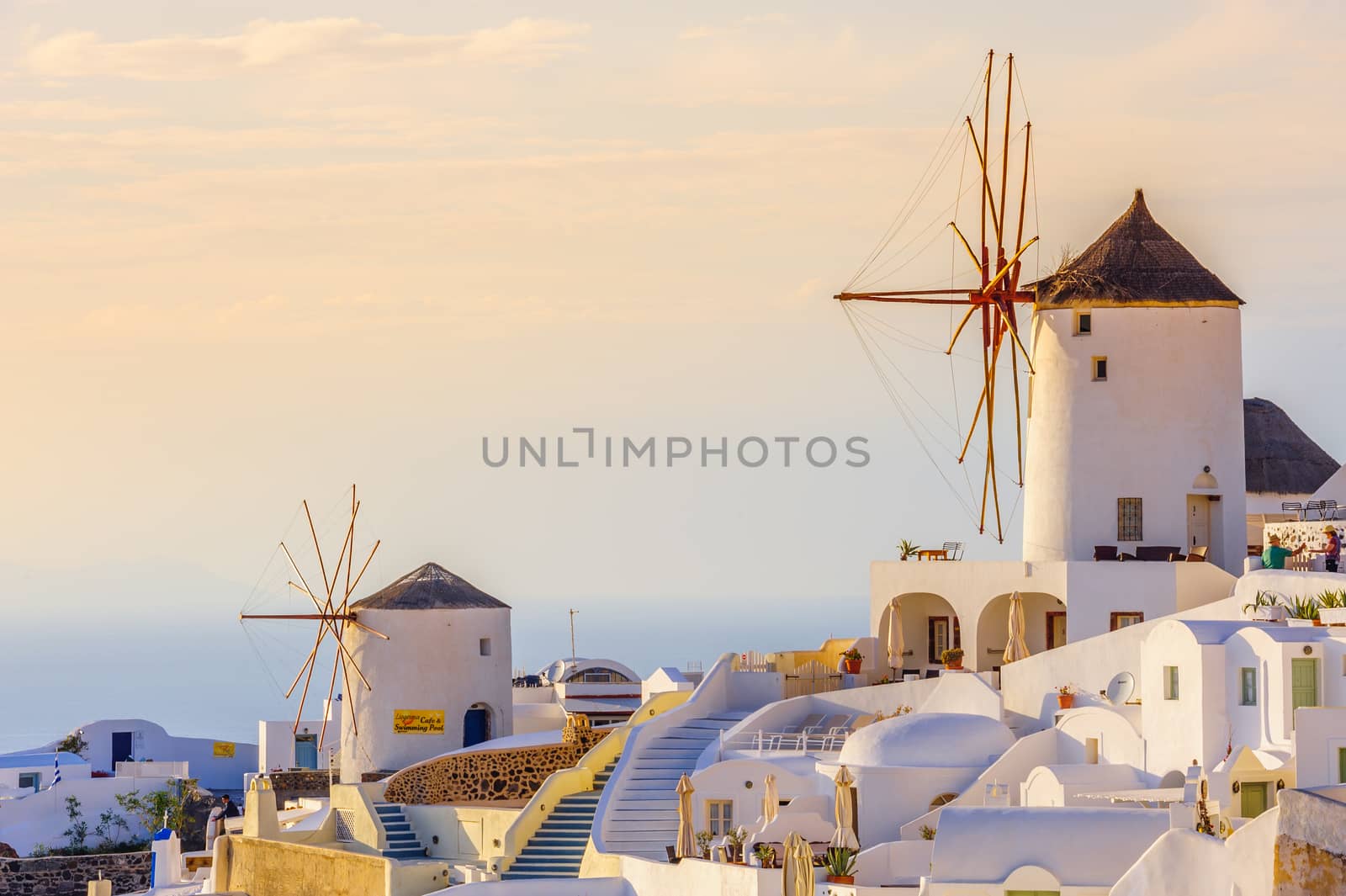 Oia in sunset rays at Santorini, Greece by starush