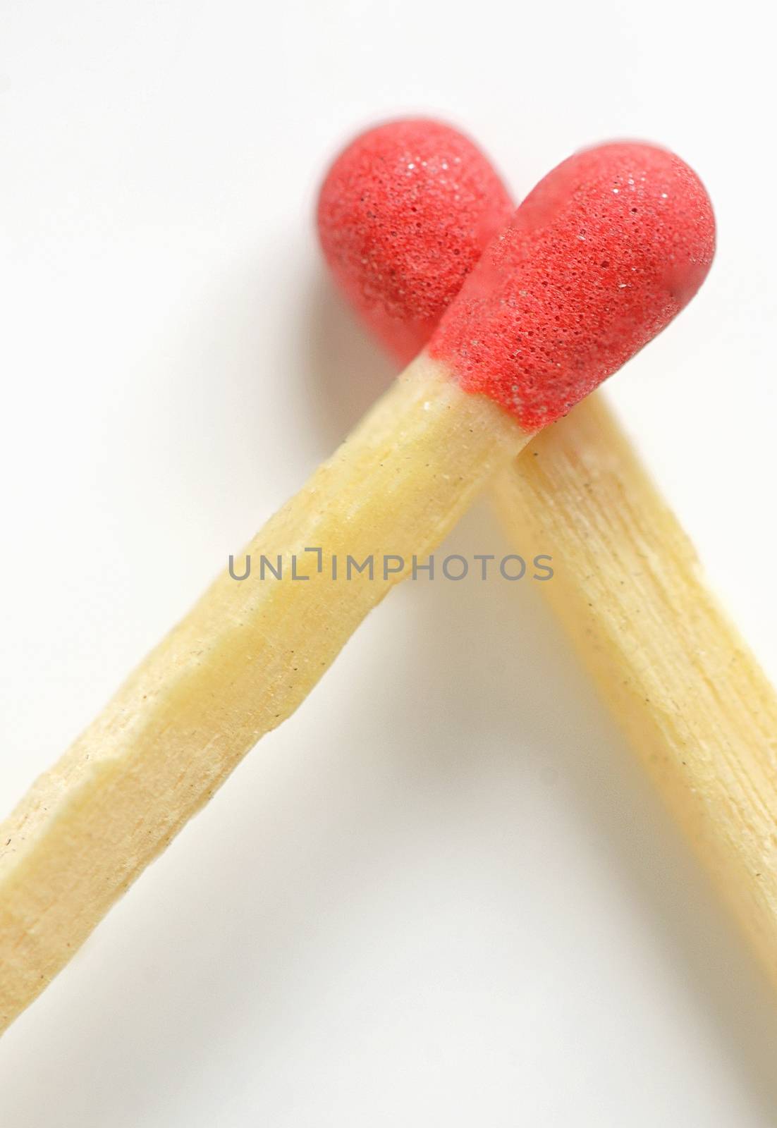 Conceptual Love from matches on white background