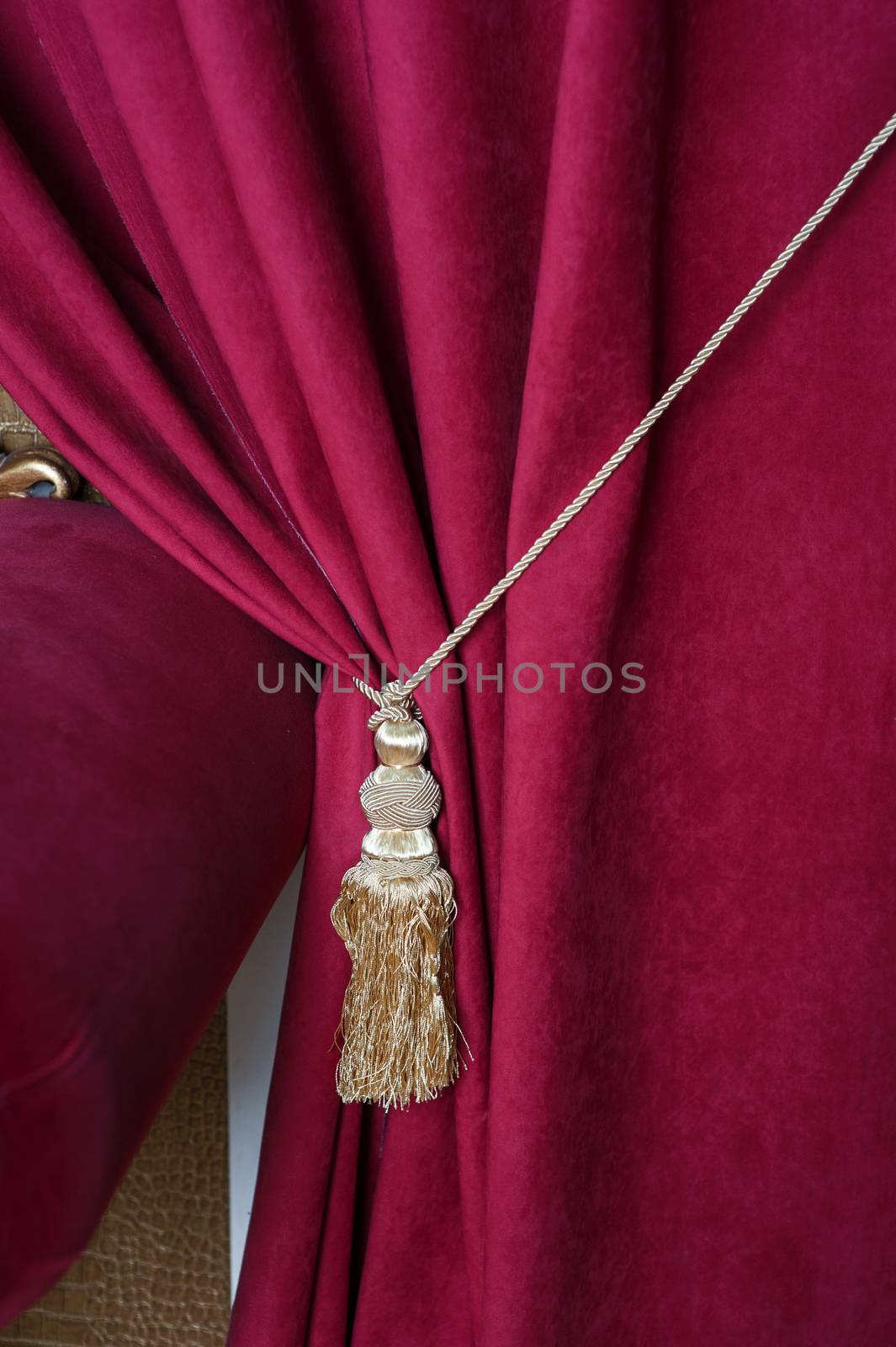 beautiful red curtain with tassel in theater by timonko