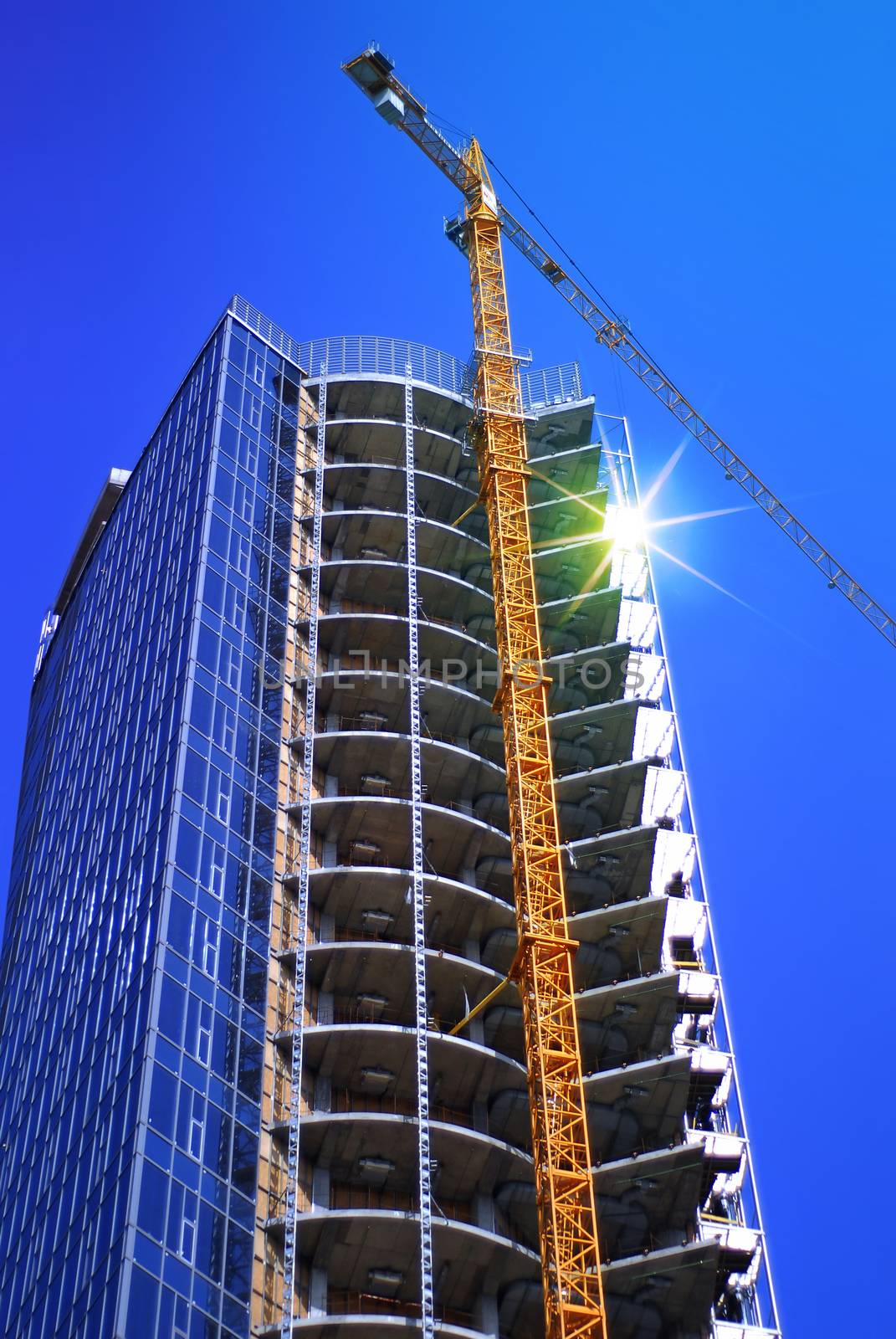 construction of modern skyscraper and building crane