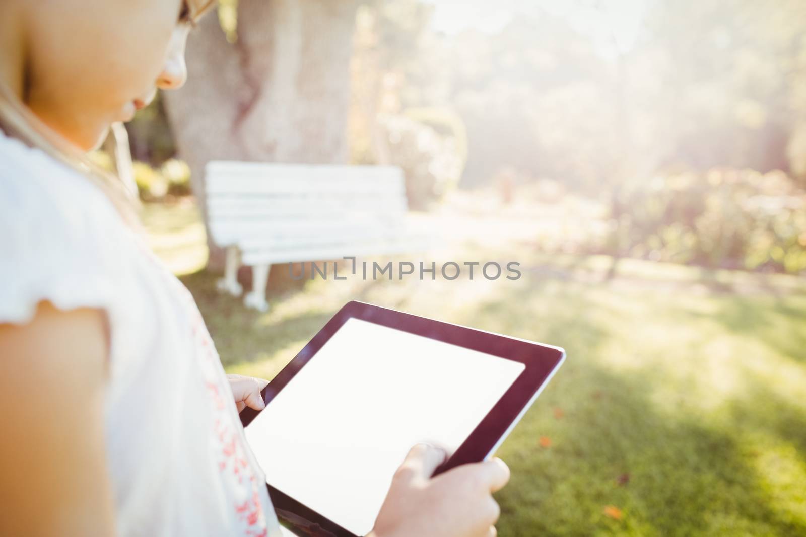 Kid using technology during a sunny day