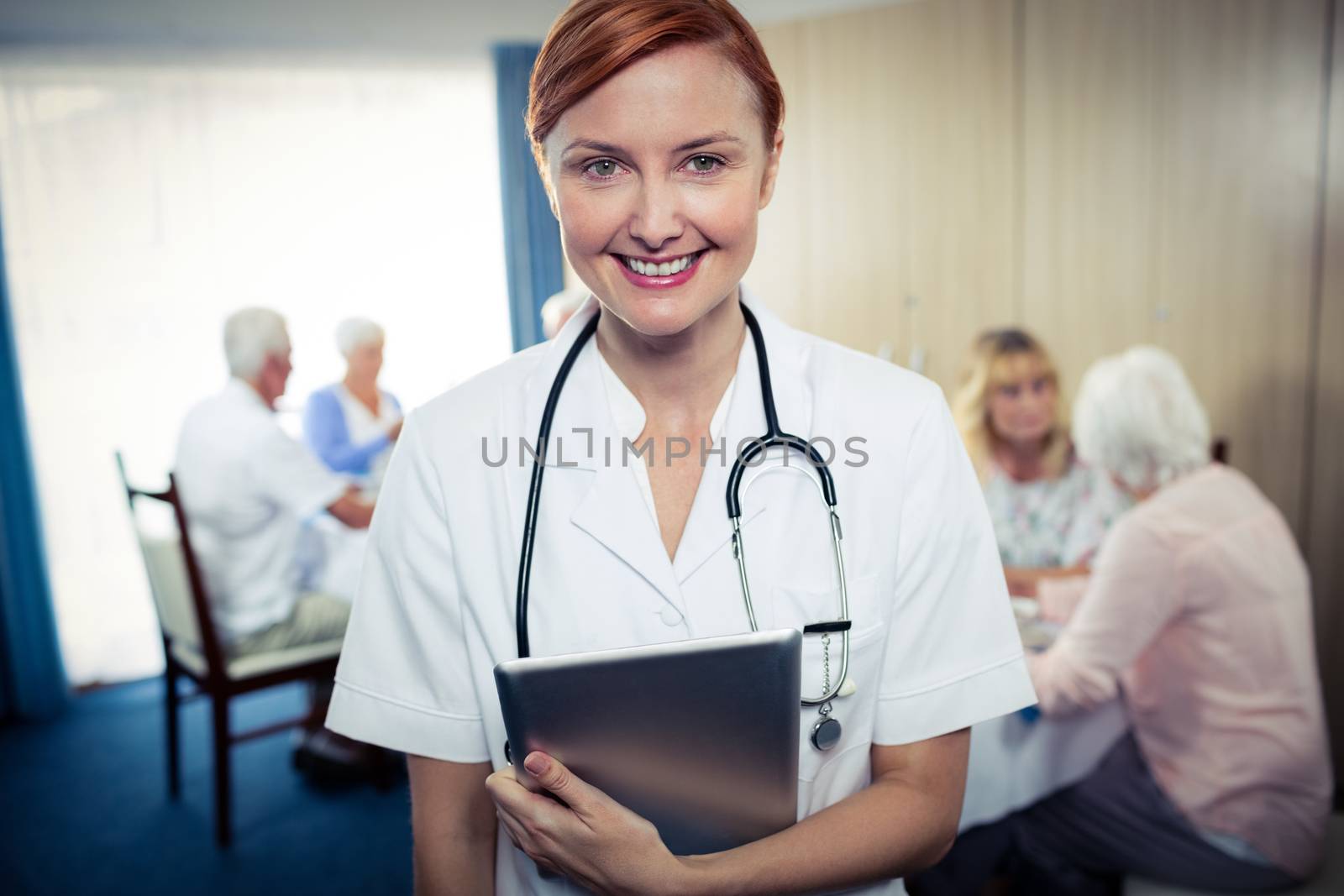 Portrait of a nurse with tablet computer by Wavebreakmedia