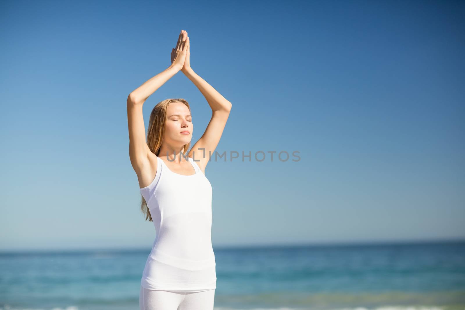 Woman performing yoga by Wavebreakmedia