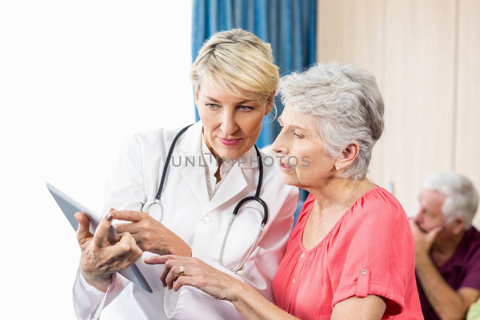 Nurse talking to a senior woman in a retirement home