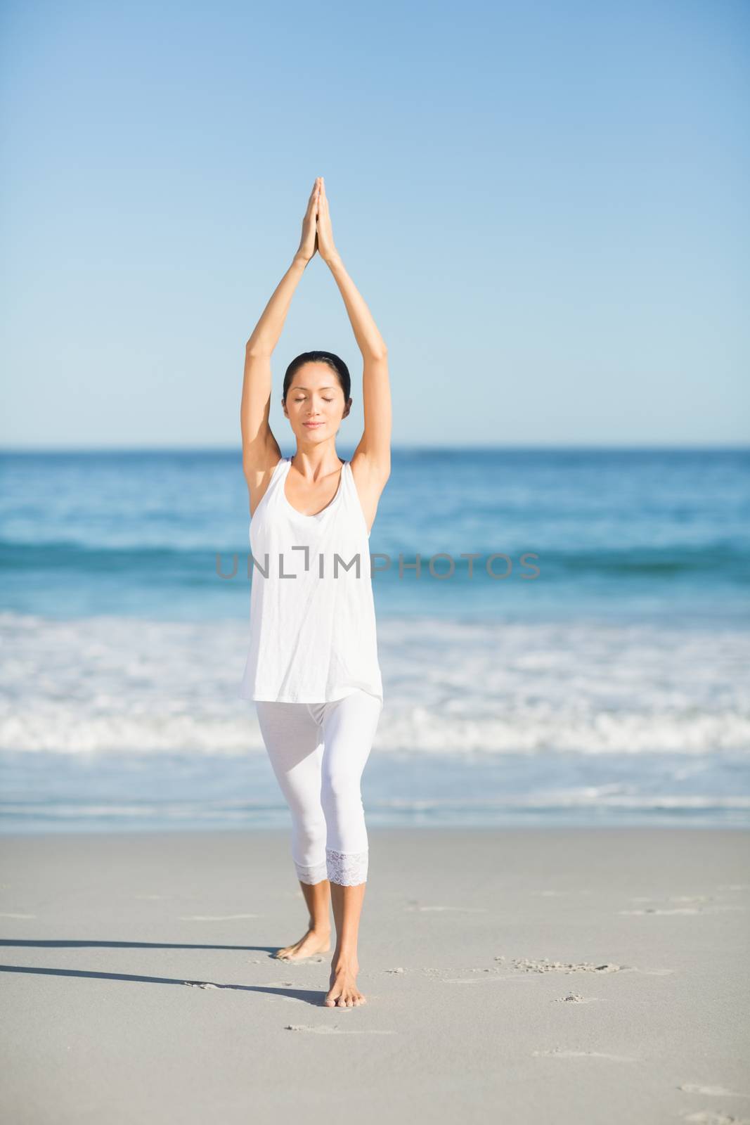 Young woman doing yoga by Wavebreakmedia