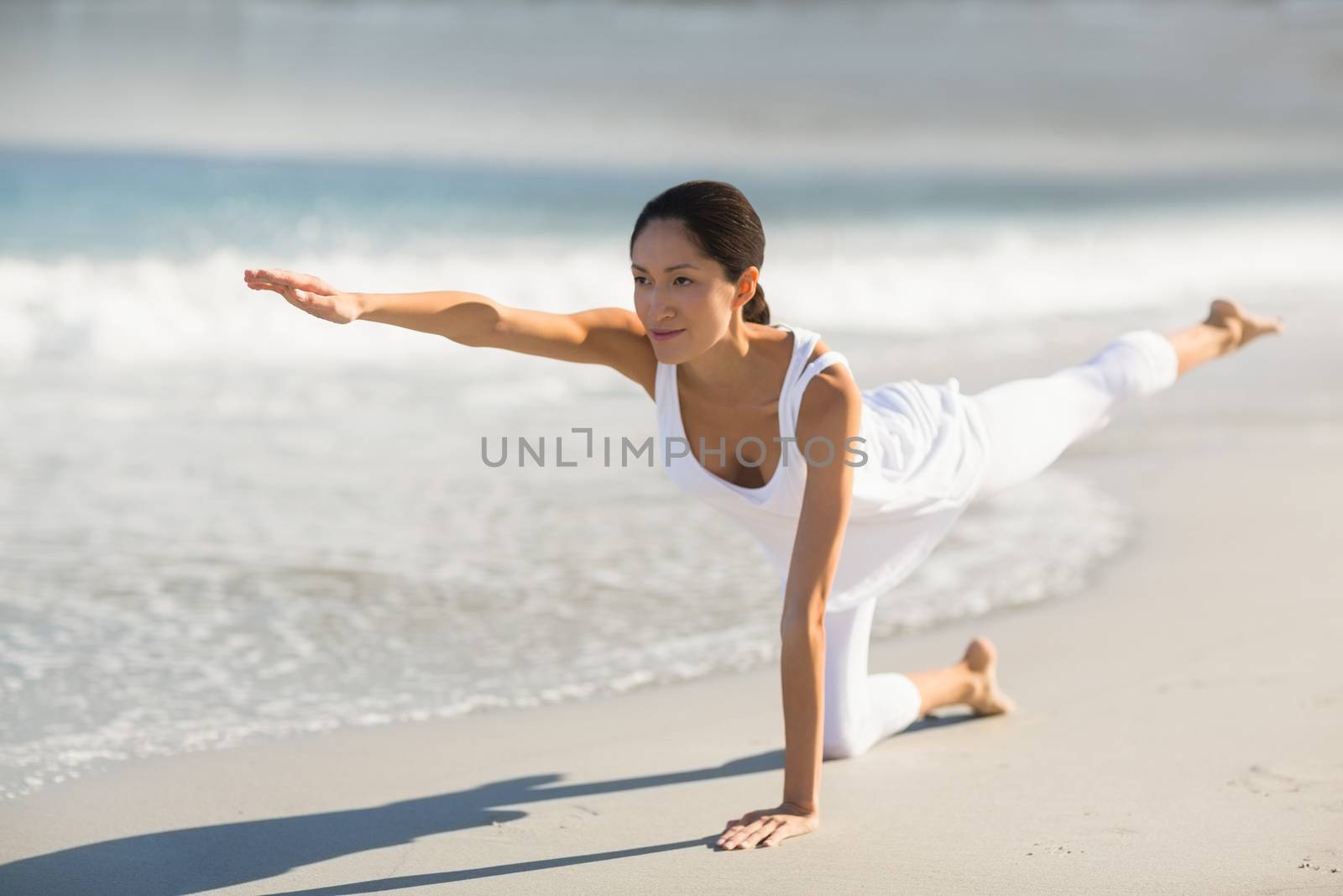 Young woman performing yoga by Wavebreakmedia