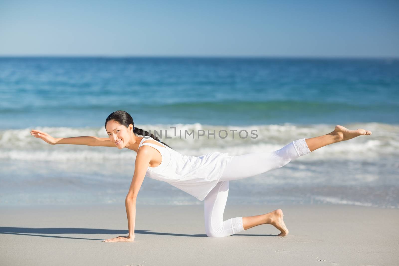 Young woman doing yoga by Wavebreakmedia