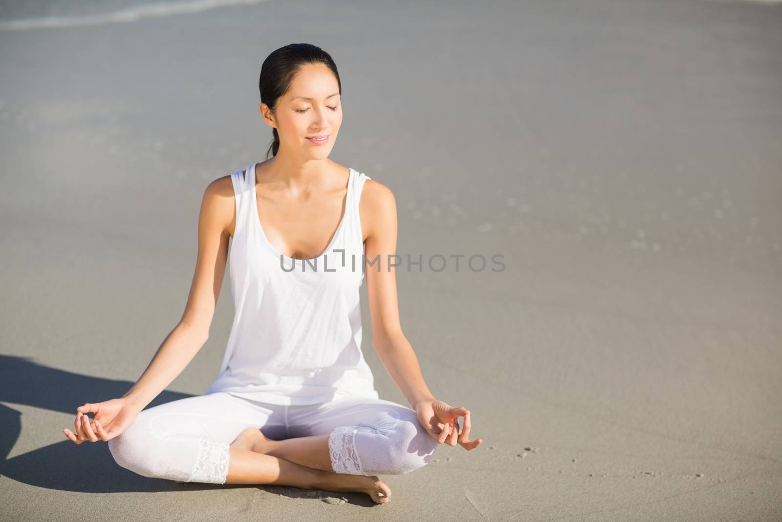Woman performing yoga  by Wavebreakmedia