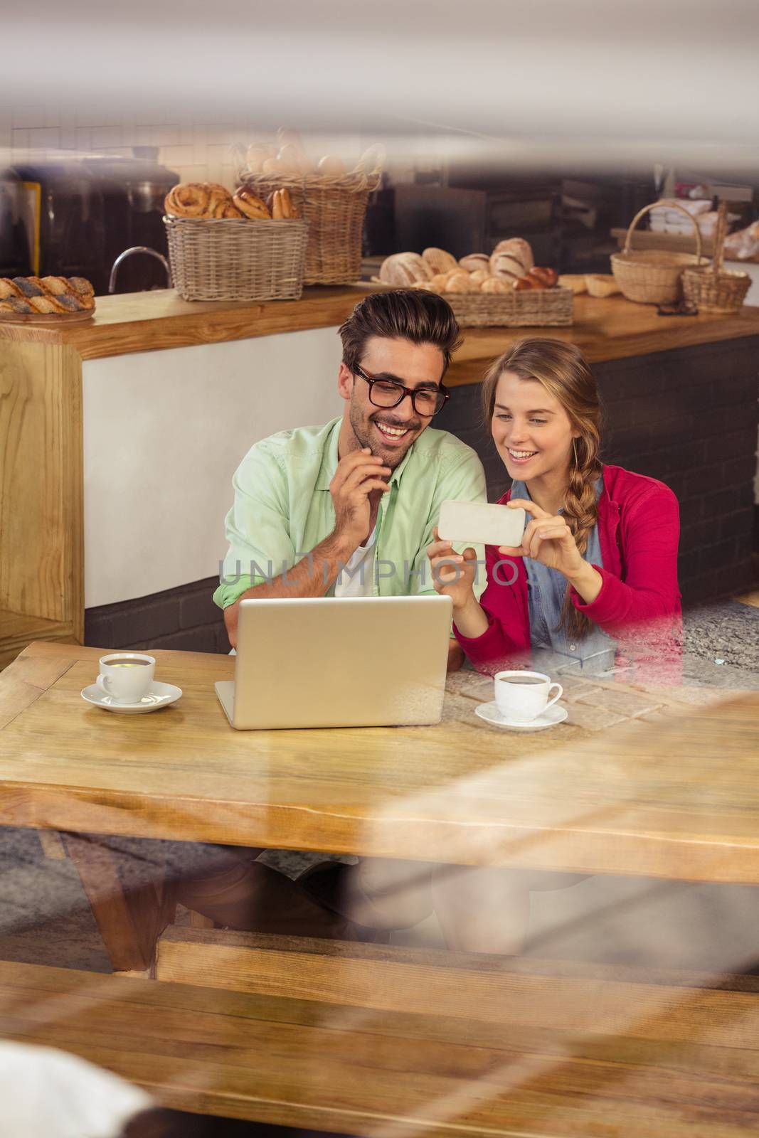 Couple using a smartphone in a restaurant