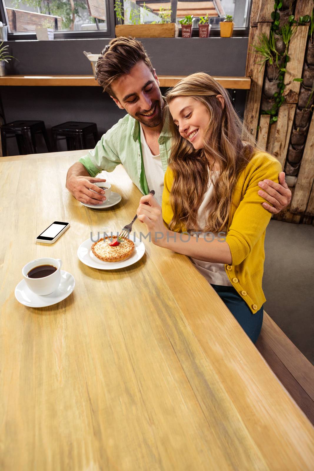 Lovely couple getting a hug in the restaurant