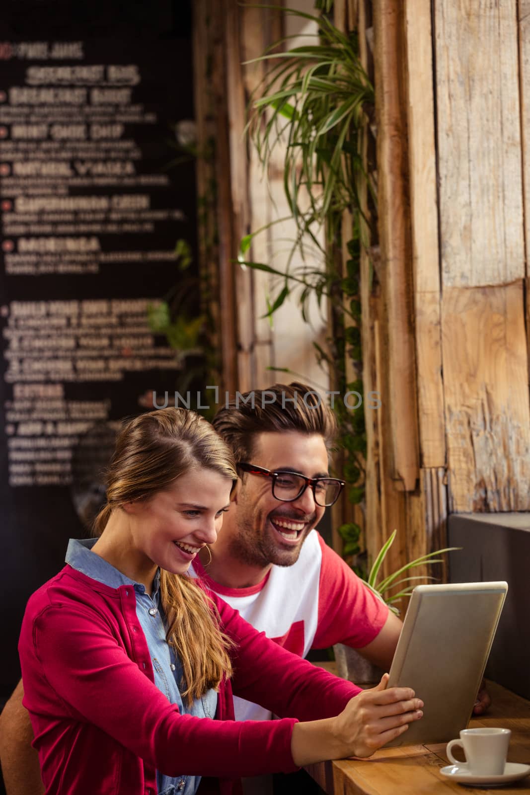 Couple using a tablet computer by Wavebreakmedia
