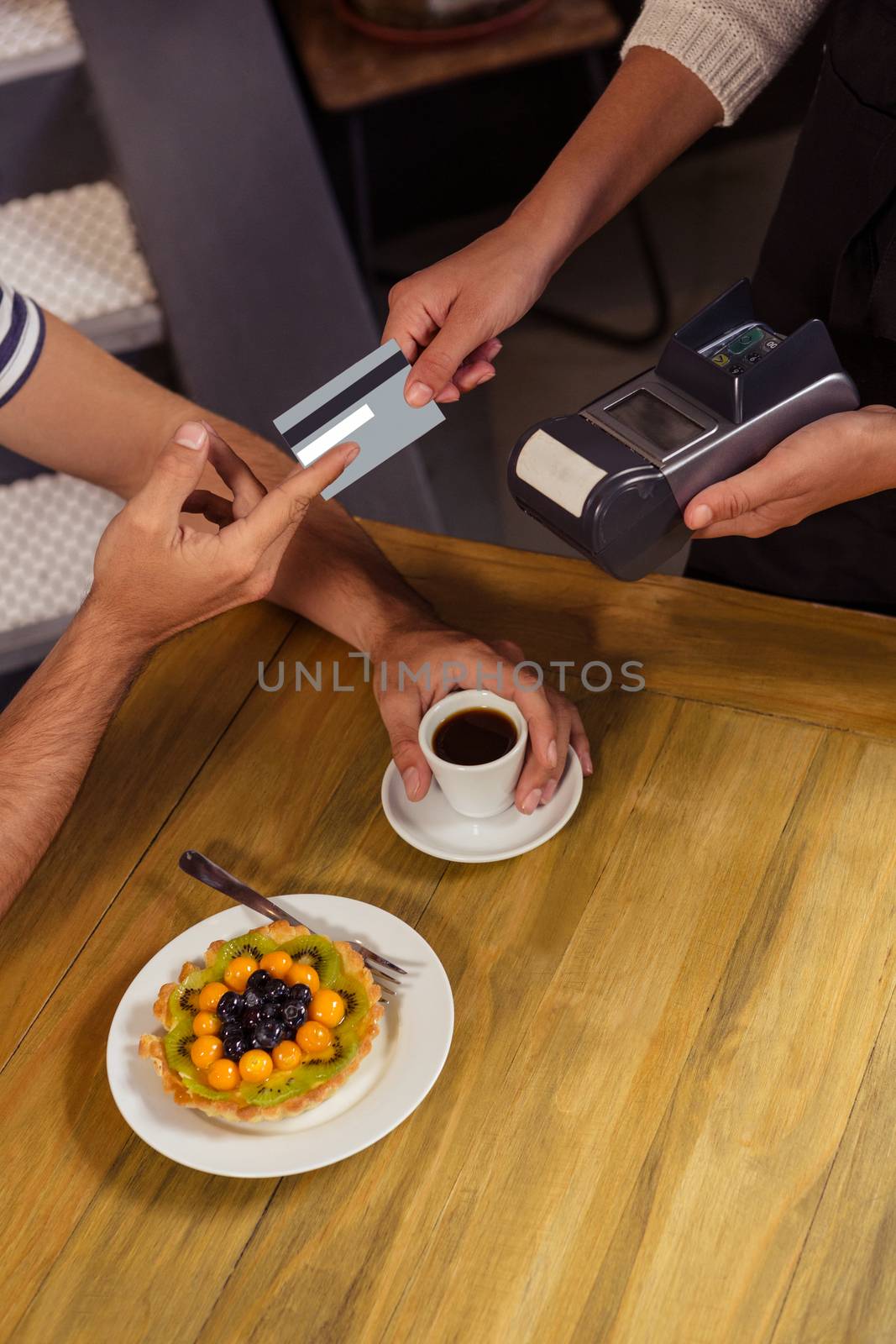 Waitress collecting payment in cafeteria