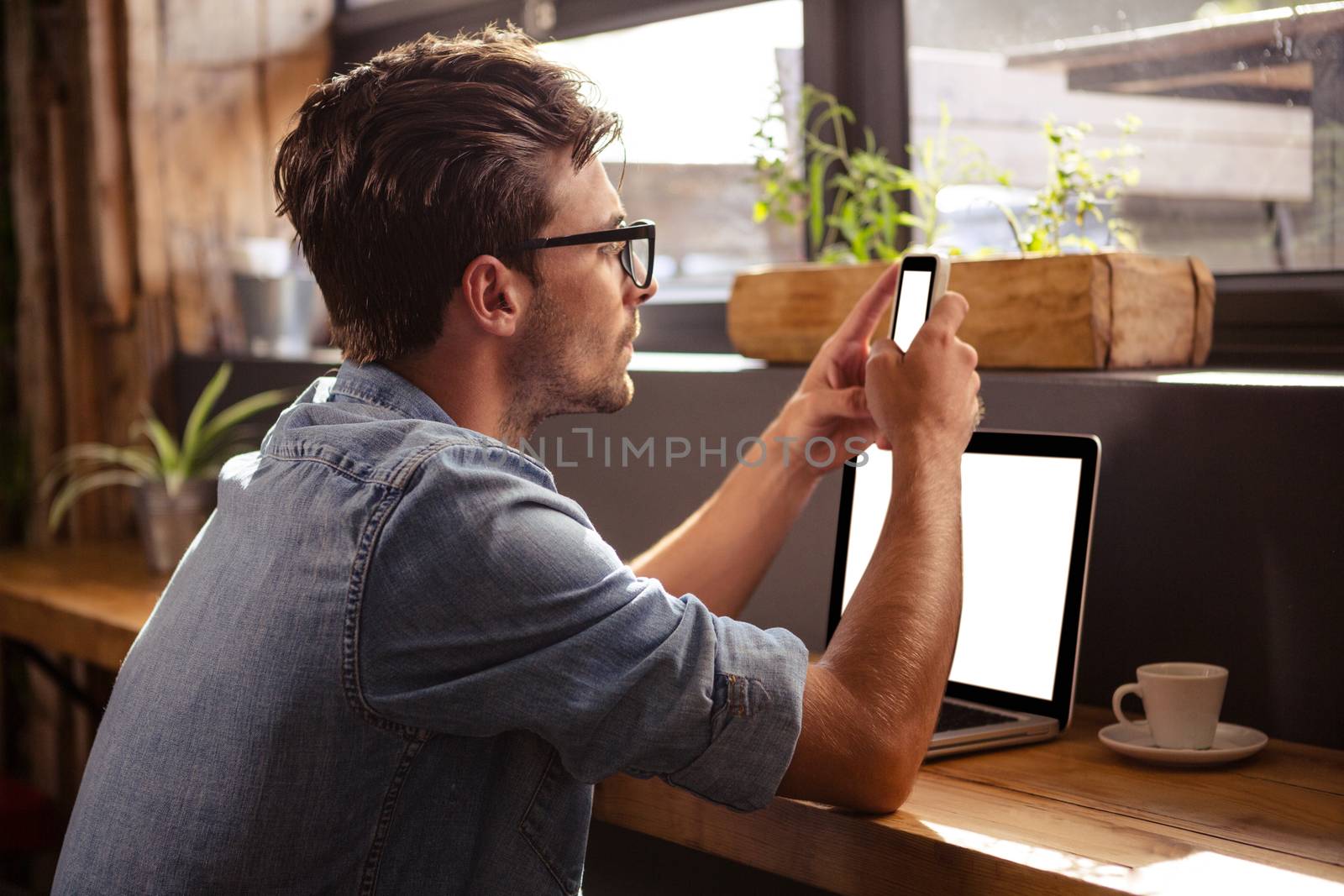 Man using technology sitting in the cafe