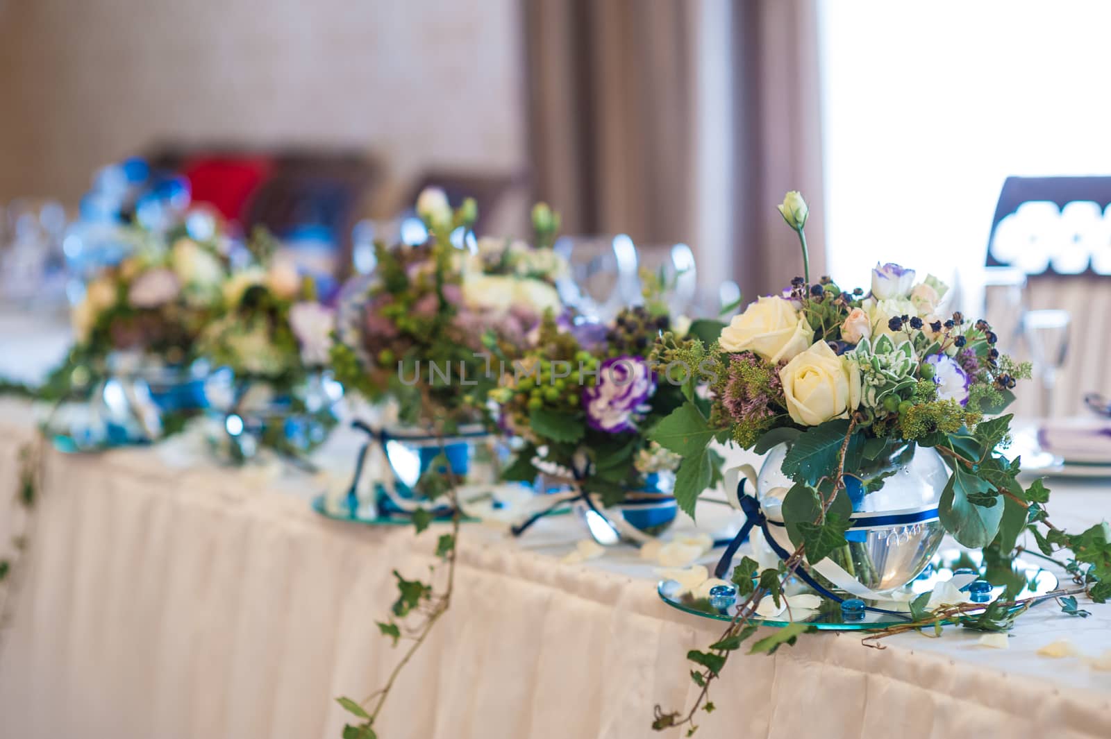 decor of flowers on wedding table bride and groom by timonko