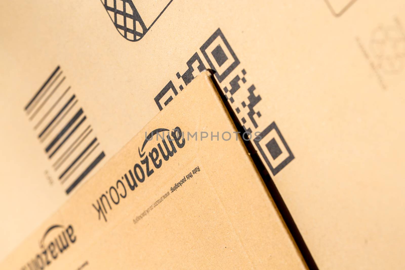 Paris, France - February 08, 2017: Amazon Prime Parcel Packages closeup. Amazon, is an American electronic commerce and cloud computing company,based in Seattle, Started as an online bookstore, Amazon is become the most importrant retailer in the United States