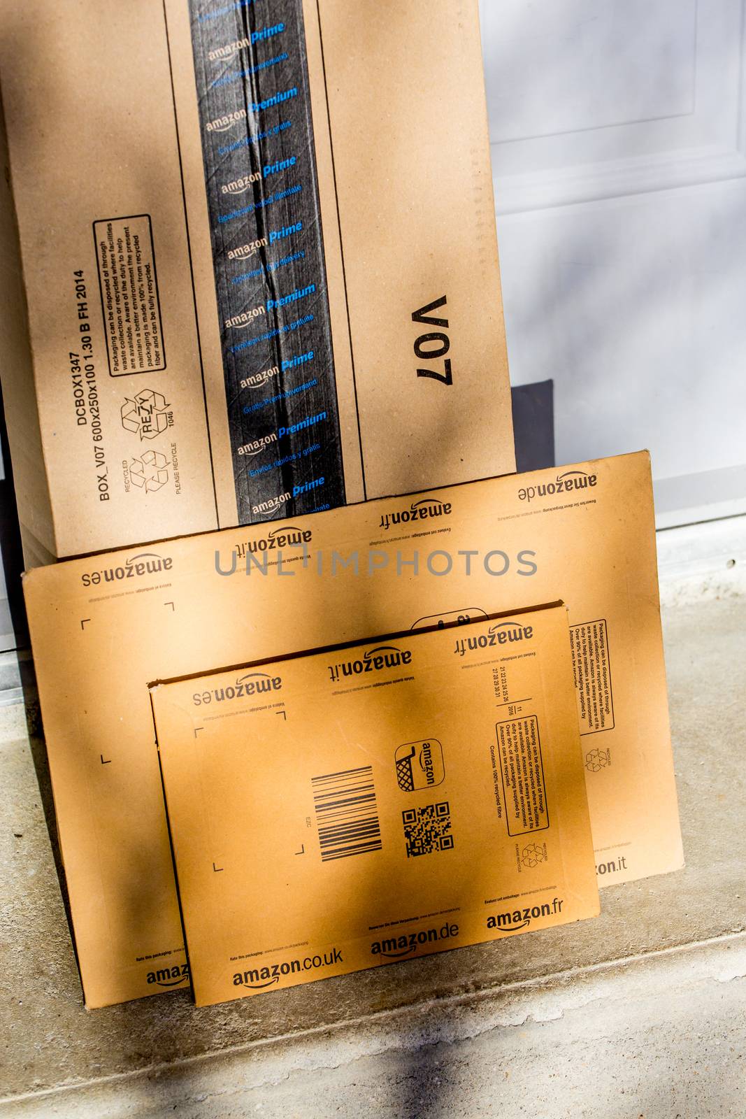 Paris, France - February 08, 2017: Amazon Prime Parcel Package in front the door of a house. Amazon, is an American electronic commerce and cloud computing company,based in Seattle, Started as an online bookstore, Amazon is become the most importrant retailer in the United States