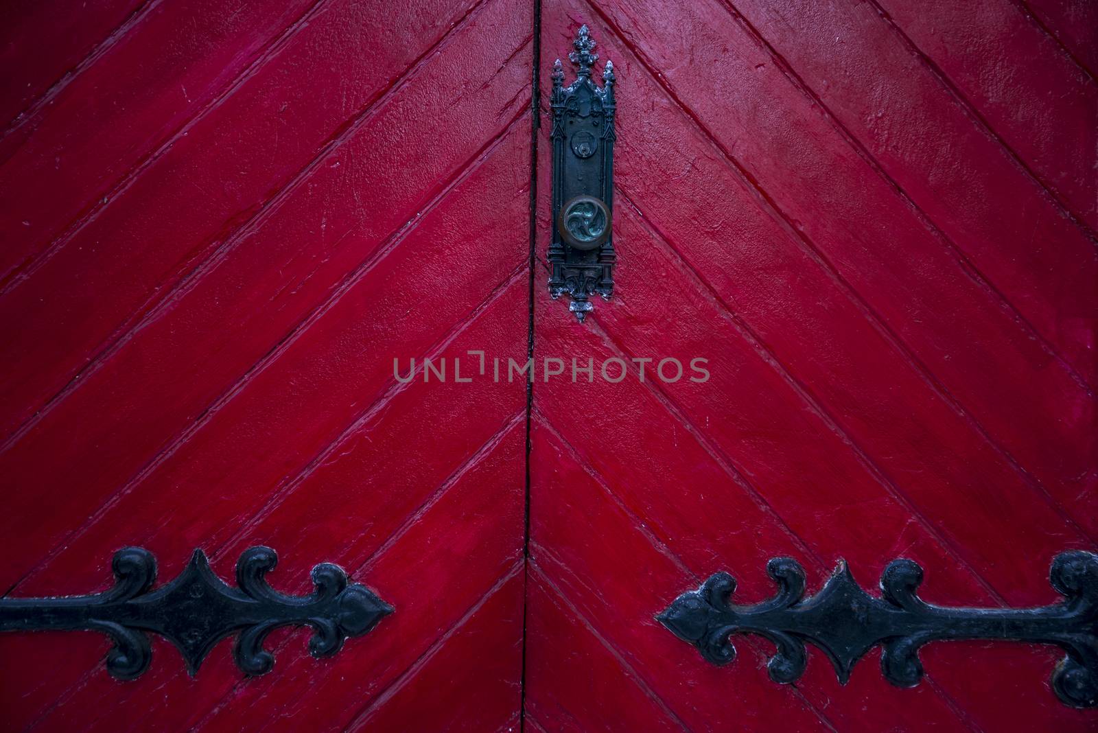 old red wooden door outside an American house in New England