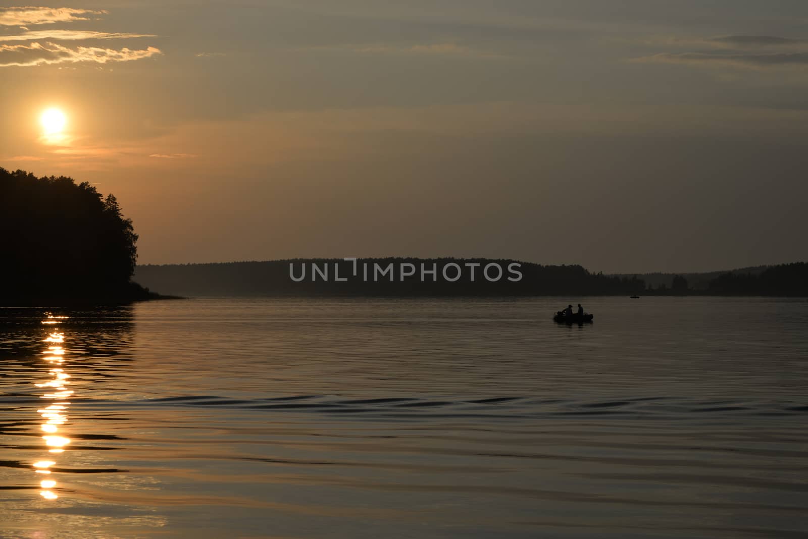 Fishermen returning late from a fishing trip in a rubber boat