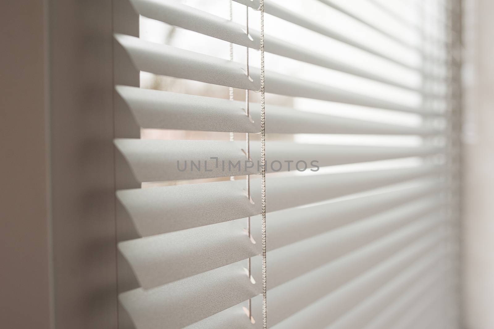 white metal blinds in the office at day