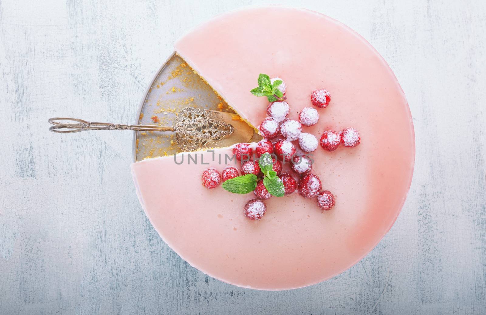 Raspberry yogurt cake on a wooden surface