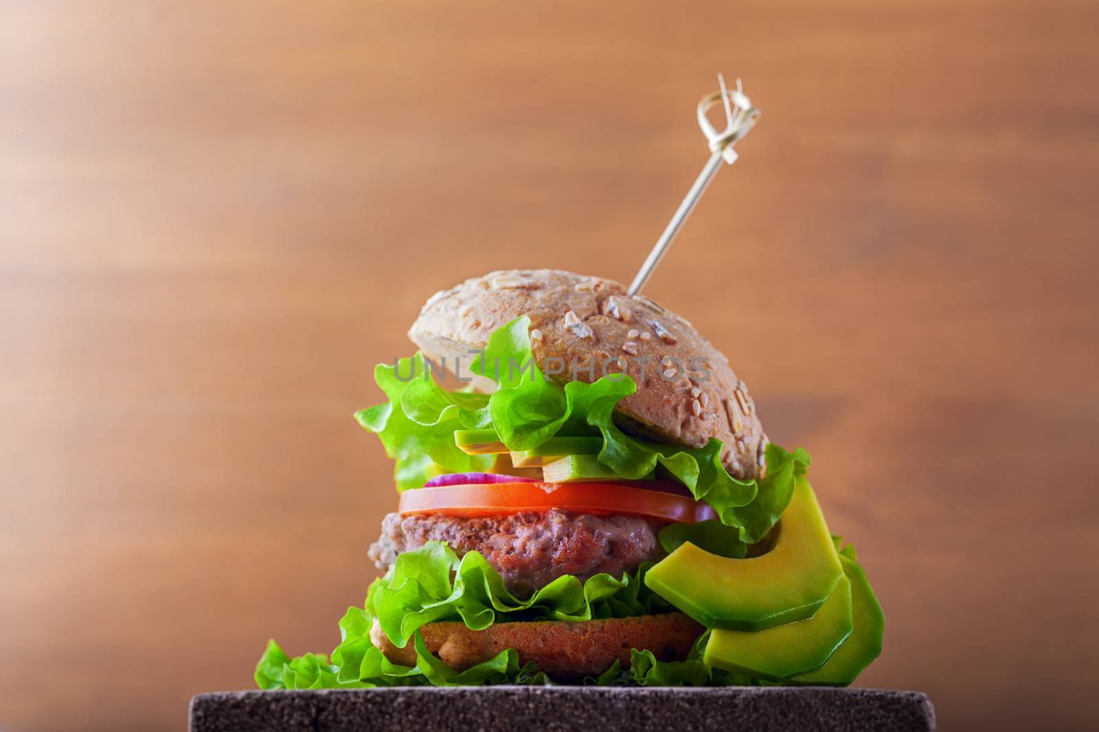 Delicious homemade burger on rustic wooden desk. by supercat67