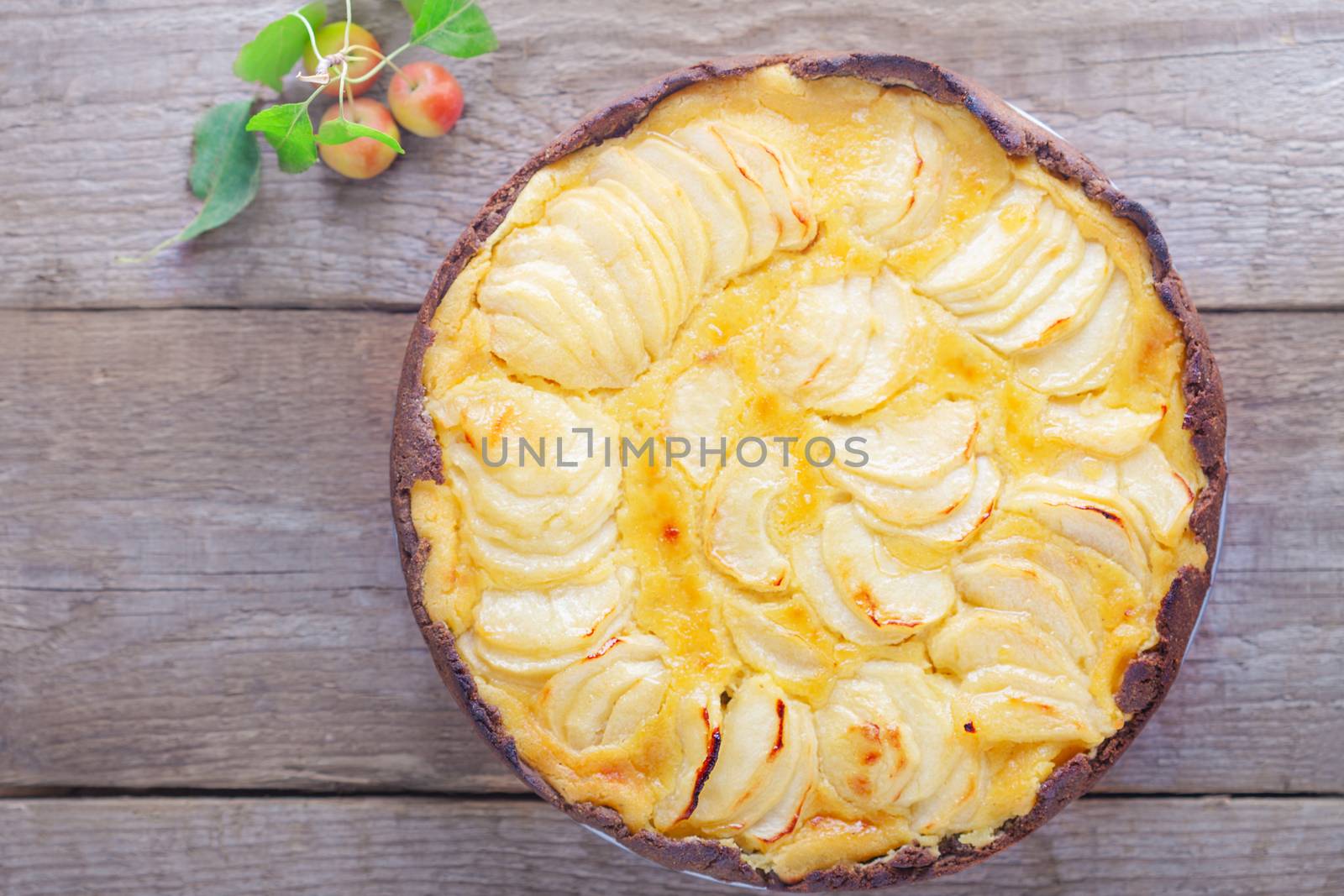 Apple pie with custard on wooden table. Gluten free.