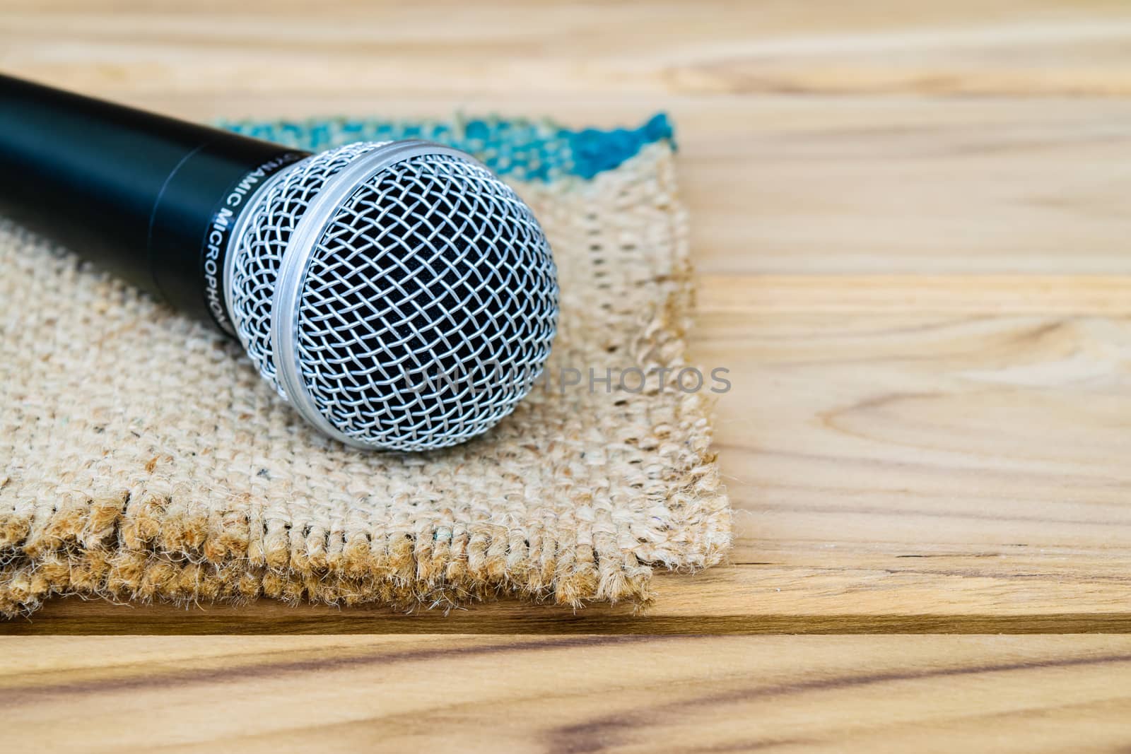 microphone on sack wooden background