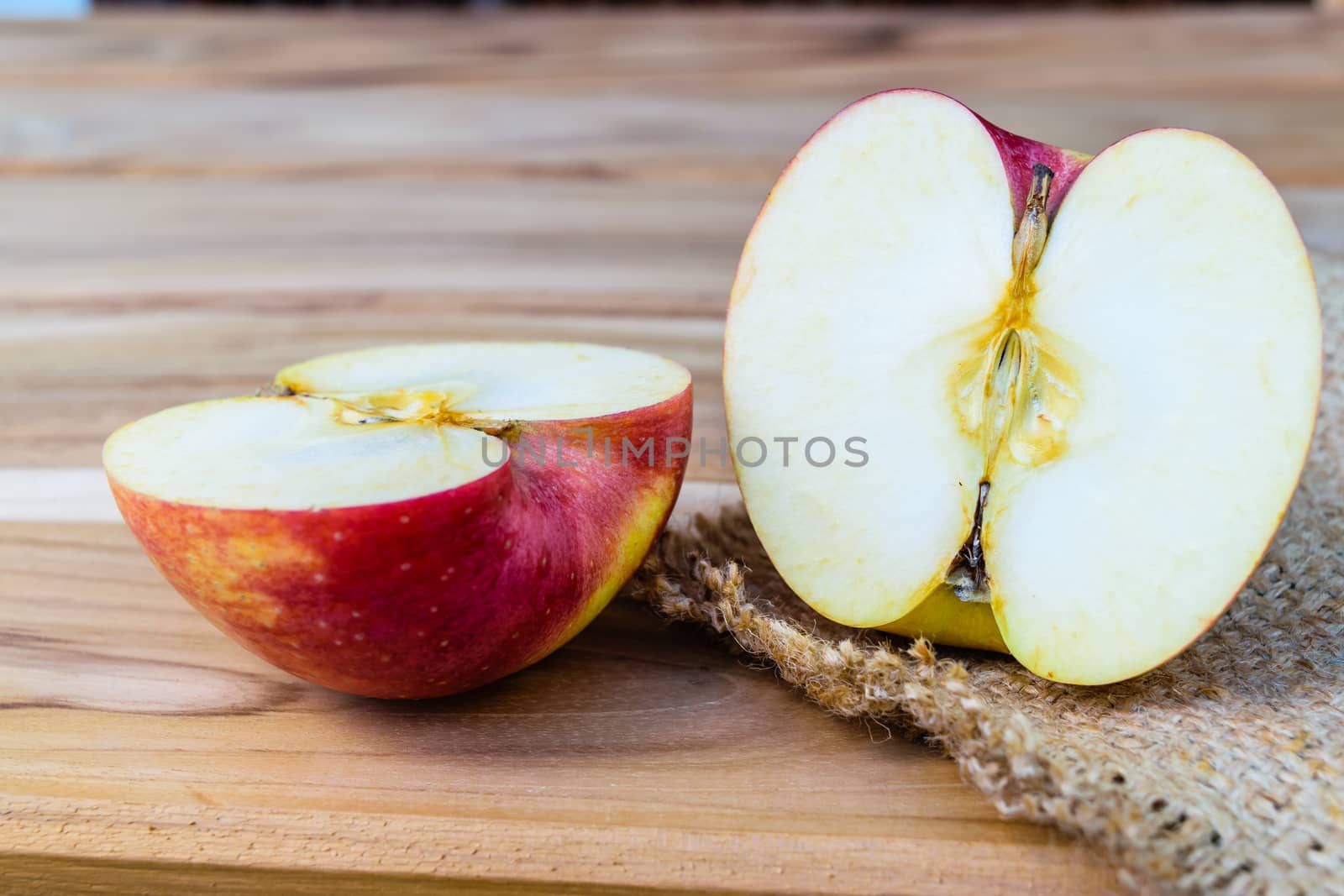 apple on sack wood background