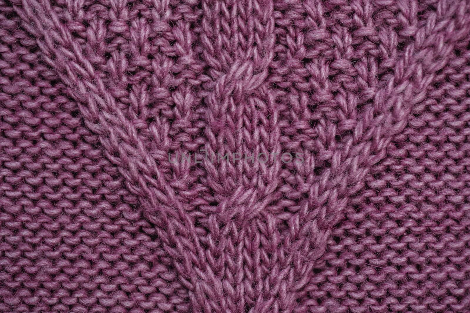 texture of lilac knitted fabric for the background.