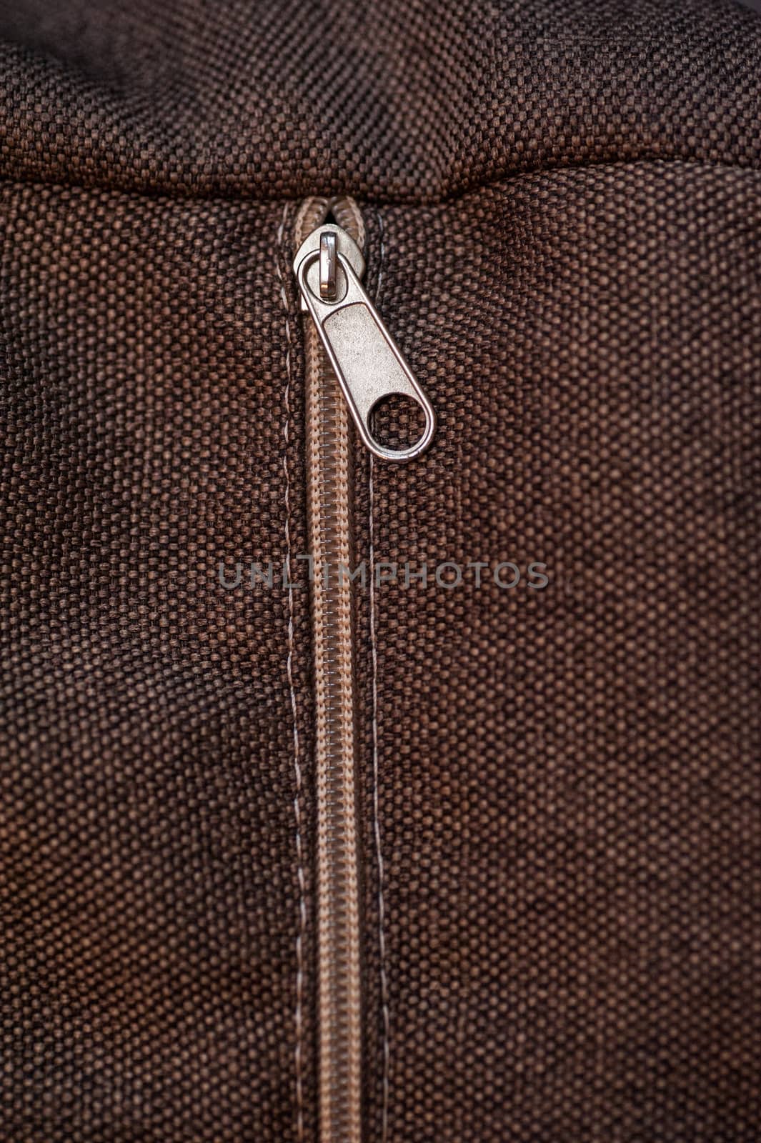 texture of brown fabric with zipper for background by timonko