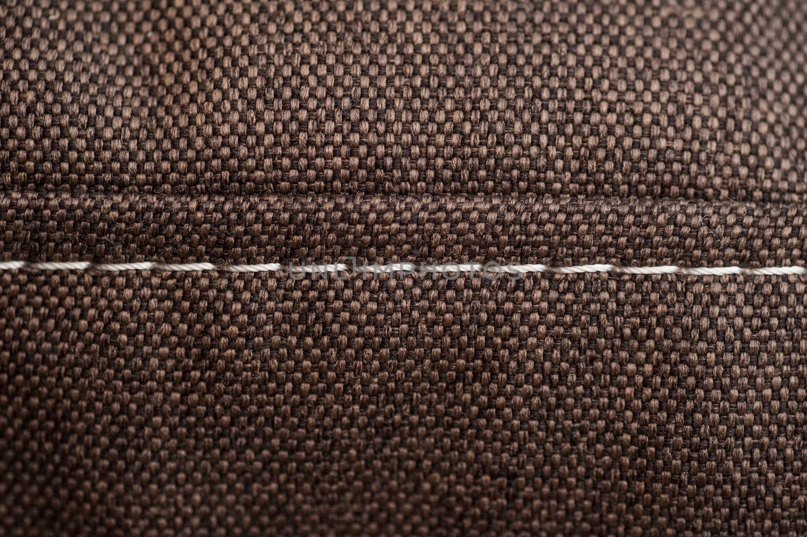 brown fabric texture with white seam for background