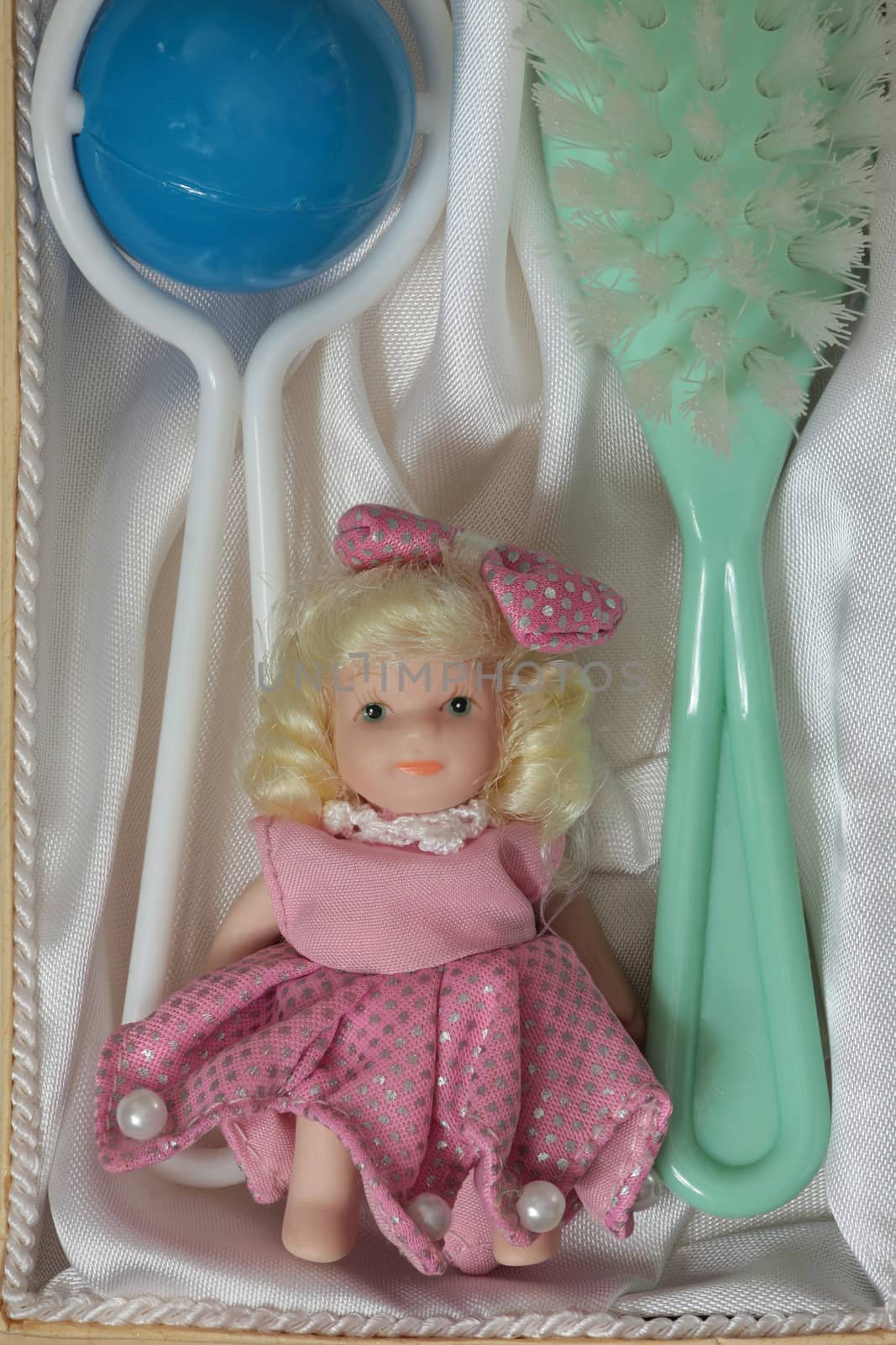 Doll Brush rattle present in the open box top view