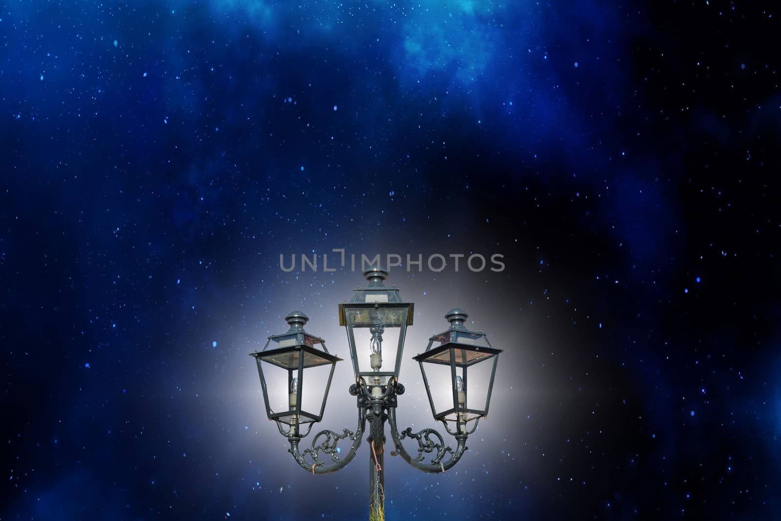 Antique candelabrum, lantern against a beautiful starry sky.