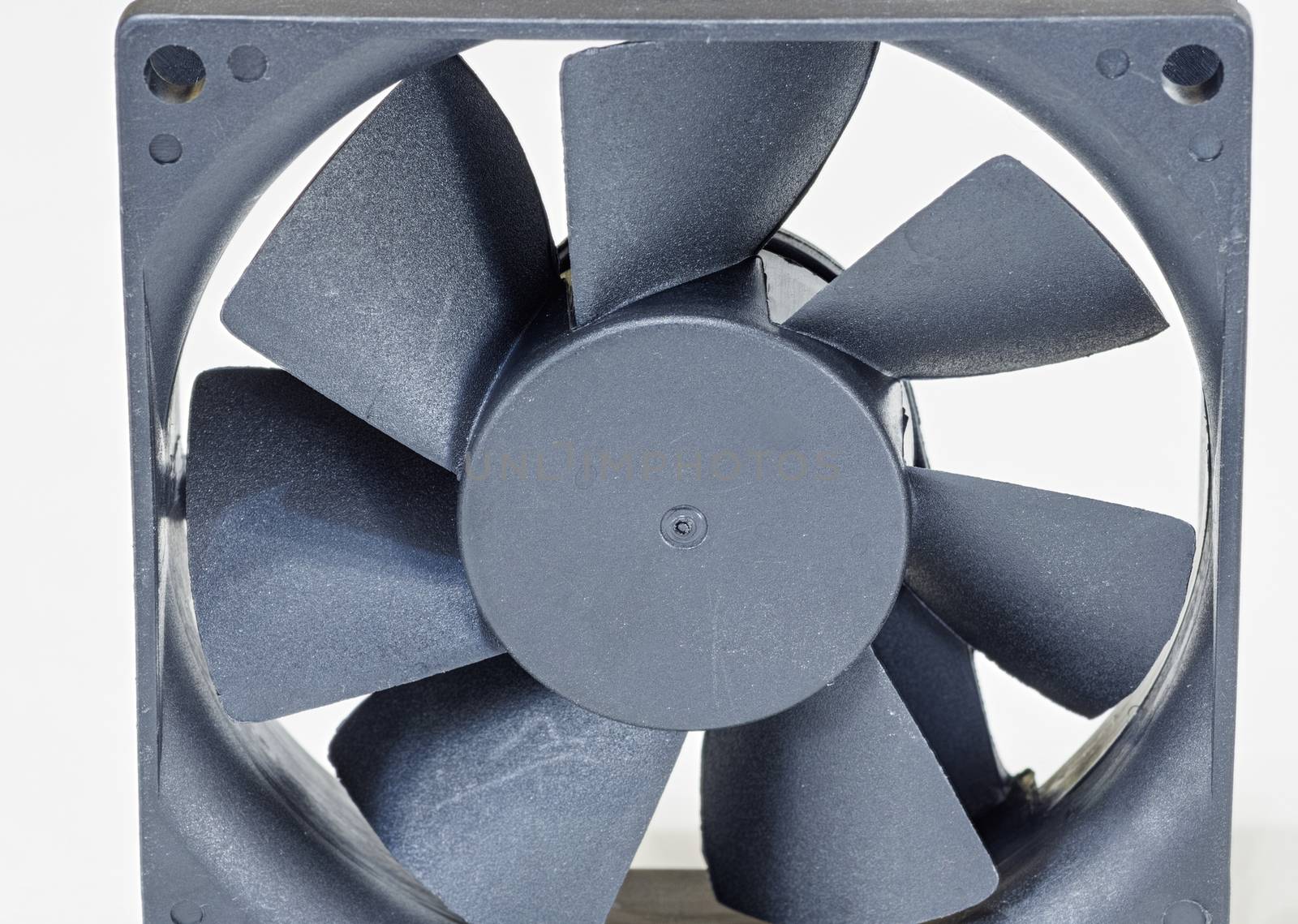 Computer fan covered in a lot of dust isolated on white