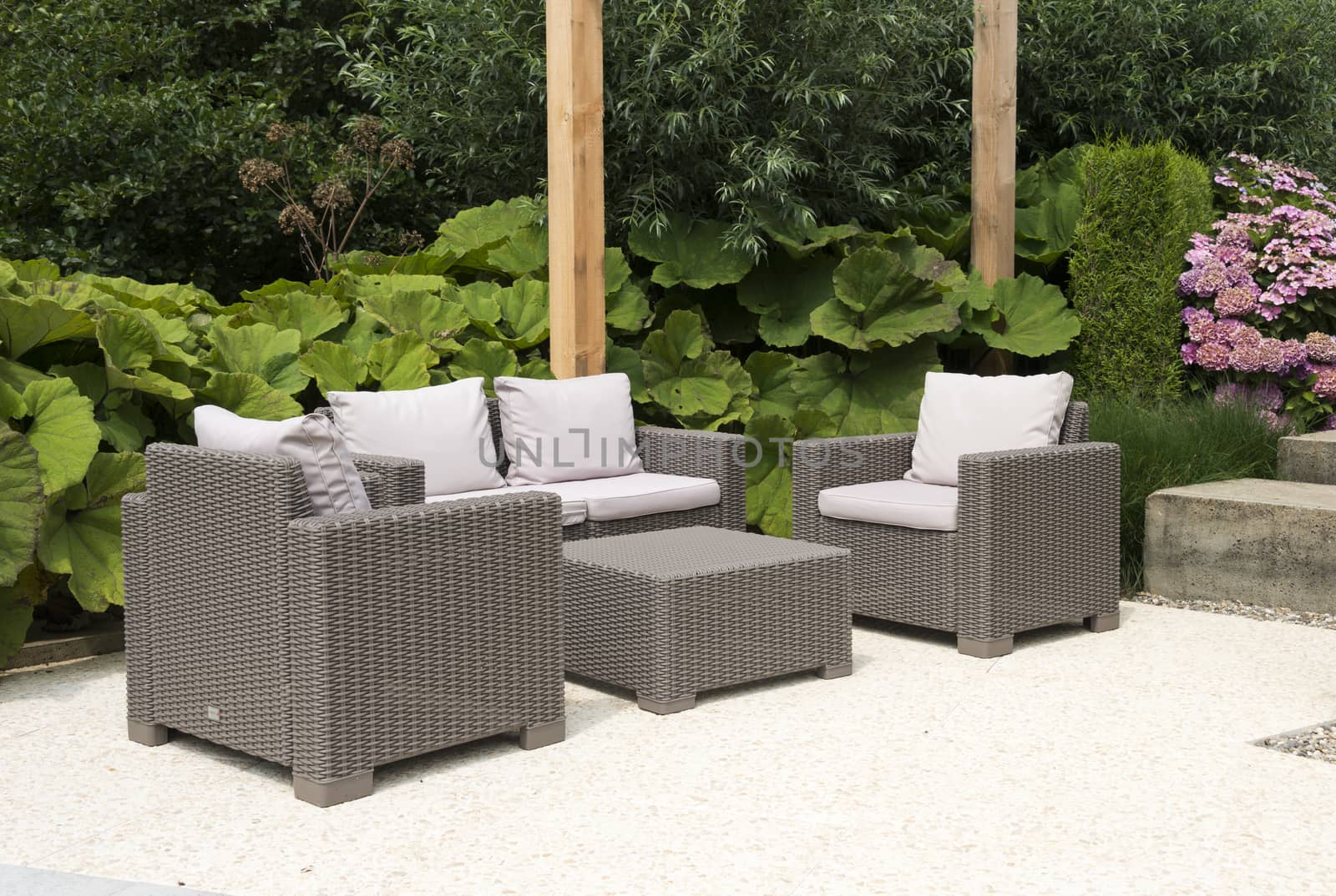 teracce with rattan relax chairs in garden